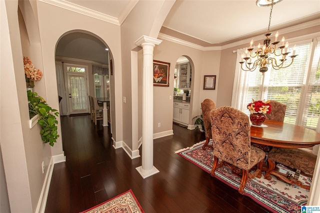 dining area with arched walkways, baseboards, a chandelier, and dark wood-style floors