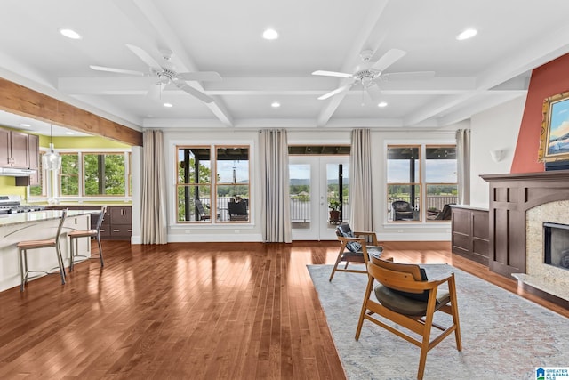 825 Dogwood Ln, Ashville, AL 35953 - living area with hardwood / wood-style flooring, beamed ceiling, a high end fireplace, and a ceiling fan