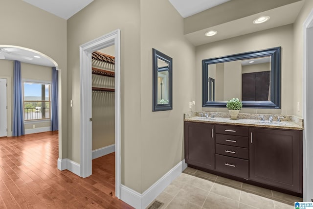 825 Dogwood Ln, Ashville, AL 35953 - bathroom featuring a sink, double vanity, baseboards, and visible vents