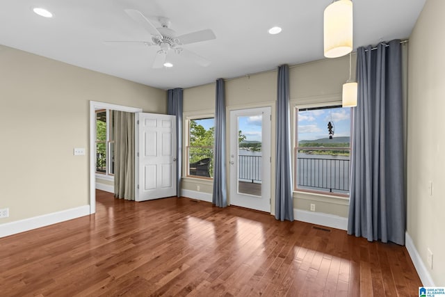 825 Dogwood Ln, Ashville, AL 35953 - spare room with a ceiling fan, a healthy amount of sunlight, visible vents, and wood finished floors