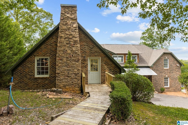 825 Dogwood Ln, Ashville, AL 35953 - tudor-style house with brick siding and a chimney