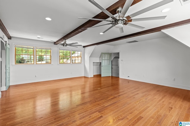 825 Dogwood Ln, Ashville, AL 35953 - unfurnished living room with light wood finished floors, visible vents, a ceiling fan, and beamed ceiling