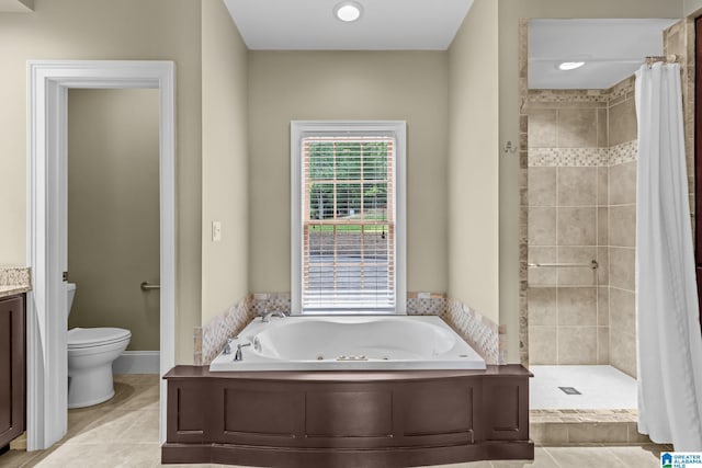 825 Dogwood Ln, Ashville, AL 35953 - full bathroom with a stall shower, toilet, a jetted tub, and tile patterned floors