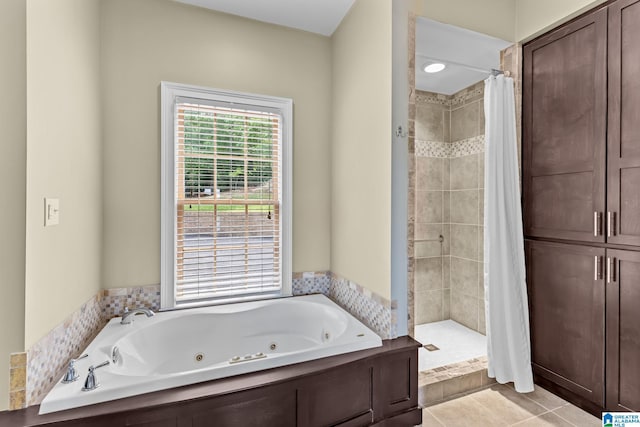 825 Dogwood Ln, Ashville, AL 35953 - full bathroom with a jetted tub, a shower stall, and tile patterned floors