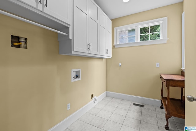 825 Dogwood Ln, Ashville, AL 35953 - laundry room featuring cabinet space, hookup for an electric dryer, visible vents, washer hookup, and baseboards