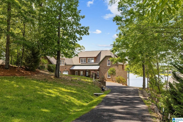 825 Dogwood Ln, Ashville, AL 35953 - view of front of property featuring a front yard, a standing seam roof, and metal roof