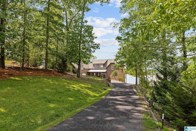 825 Dogwood Ln, Ashville, AL 35953 - tudor home with a garage and a front lawn