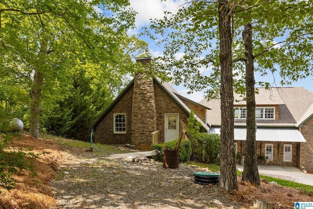 825 Dogwood Ln, Ashville, AL 35953 - view of front of home featuring a chimney and a patio area