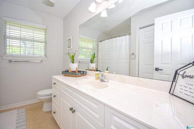 full bathroom featuring toilet, tile patterned floors, vanity, baseboards, and a shower with curtain