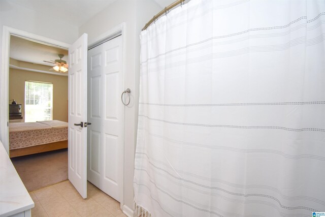bathroom featuring tile patterned flooring and ceiling fan
