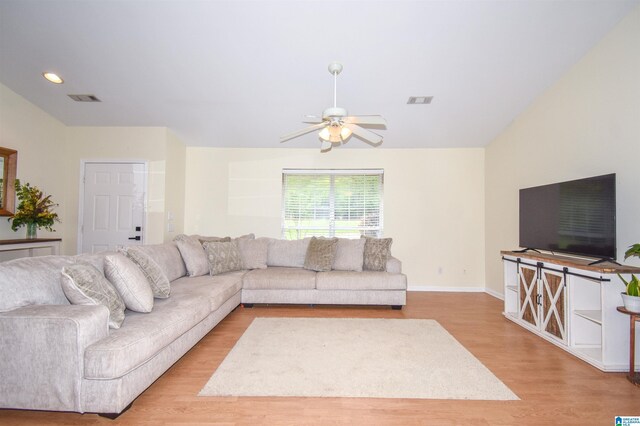 living area with light wood-style flooring, ceiling fan, baseboards, and recessed lighting