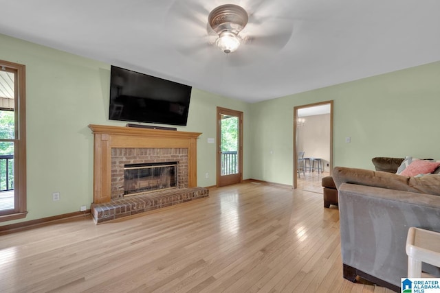 3043 Hunters Run, Gardendale, AL 35071 - living room with a ceiling fan, healthy amount of natural light, wood finished floors, and a fireplace