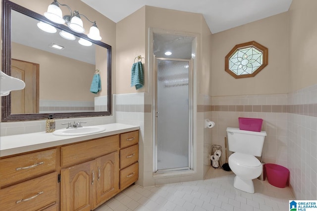 3043 Hunters Run, Gardendale, AL 35071 - bathroom featuring tile walls, tile patterned flooring, vanity, toilet, and a shower stall