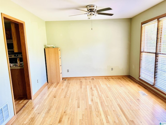 3043 Hunters Run, Gardendale, AL 35071 - empty room featuring light wood-style flooring, ceiling fan, and baseboards