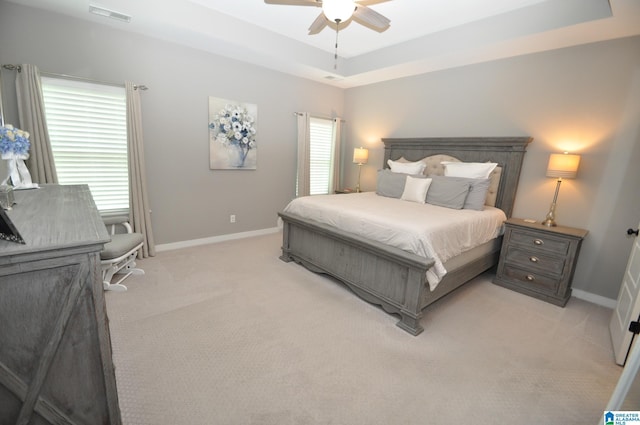298 Appleford Rd, Helena, AL 35080 - bedroom featuring light carpet, baseboards, a tray ceiling, and ceiling fan