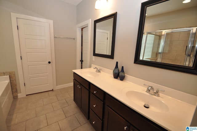 298 Appleford Rd, Helena, AL 35080 - full bathroom featuring a stall shower, tile patterned floors, double vanity, a bath, and baseboards