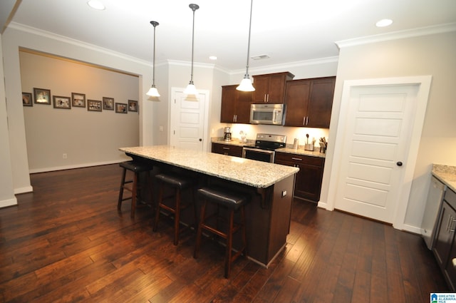 298 Appleford Rd, Helena, AL 35080 - kitchen with stainless steel appliances, a breakfast bar area, dark brown cabinets, a center island, and light stone countertops