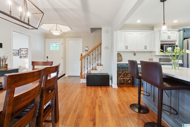 2616 Chimney Hills Cir, Vestavia Hills, AL 35226 - dining room featuring stairway, recessed lighting, and light wood-style floors