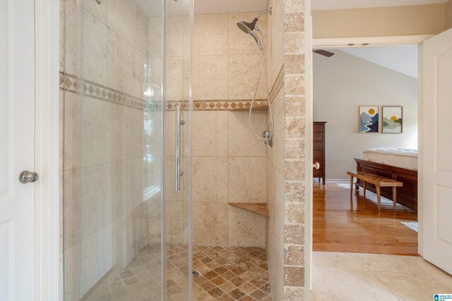 2616 Chimney Hills Cir, Vestavia Hills, AL 35226 - bathroom with a shower stall, vaulted ceiling, and wood finished floors