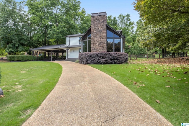 2616 Chimney Hills Cir, Vestavia Hills, AL 35226 - view of side of home with concrete driveway, a chimney, and an attached carport