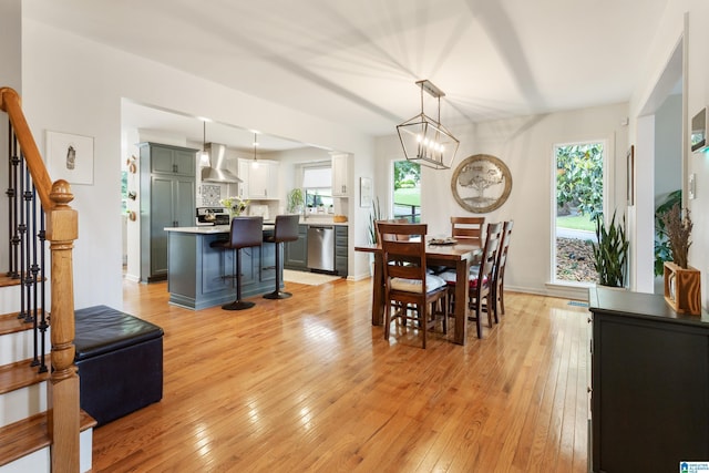 2616 Chimney Hills Cir, Vestavia Hills, AL 35226 - dining area with light wood finished floors, stairs, a chandelier, and baseboards
