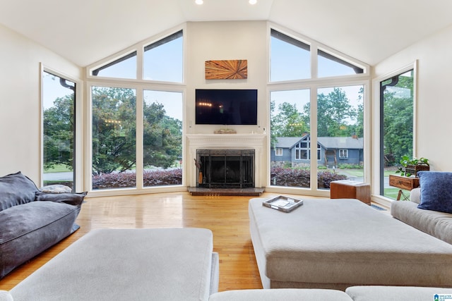 2616 Chimney Hills Cir, Vestavia Hills, AL 35226 - living area with vaulted ceiling, plenty of natural light, a high end fireplace, and wood finished floors