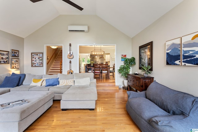 2616 Chimney Hills Cir, Vestavia Hills, AL 35226 - living area with stairway, an AC wall unit, light wood-type flooring, ceiling fan, and high vaulted ceiling