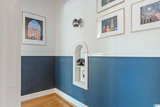 detailed view of baseboards and wood finished floors