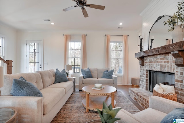 0571 Preserve Pkwy, Hoover, AL 35226 - living room with a brick fireplace, ceiling fan, ornamental molding, wood finished floors, and recessed lighting