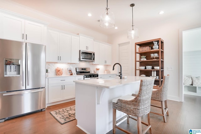 0571 Preserve Pkwy, Hoover, AL 35226 - kitchen with stainless steel appliances, light wood-style floors, white cabinetry, decorative backsplash, and recessed lighting