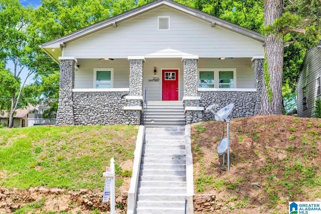 2624 29th St, Birmingham, AL 35208 - bungalow with stairway, stone siding, and a porch