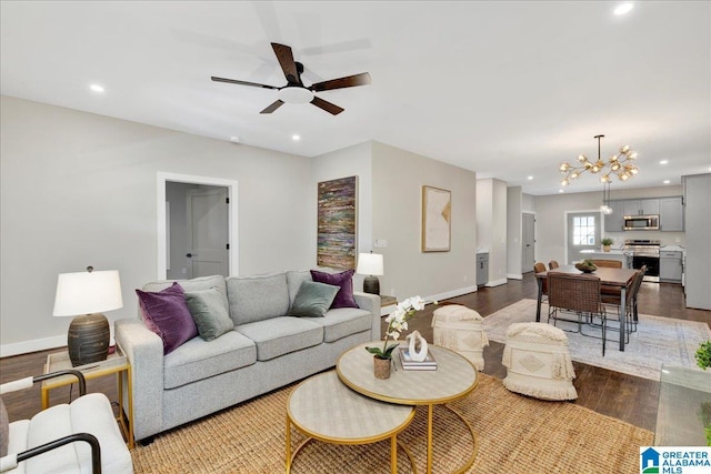 2624 29th St, Birmingham, AL 35208 - living area featuring wood finished floors, a ceiling fan, a chandelier, baseboards, and recessed lighting