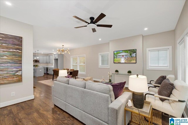 2624 29th St, Birmingham, AL 35208 - living room with a chandelier, dark wood finished floors, recessed lighting, baseboards, and a ceiling fan