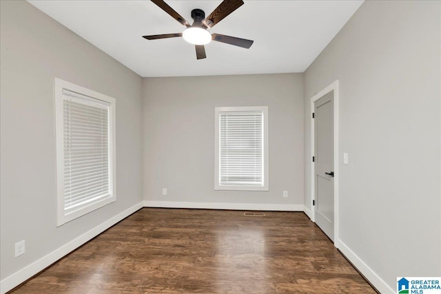 2624 29th St, Birmingham, AL 35208 - spare room featuring ceiling fan, wood finished floors, and baseboards