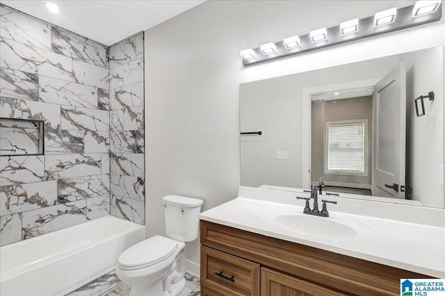2624 29th St, Birmingham, AL 35208 - bathroom with marble look tiles, toilet, vanity, and shower / tub combination