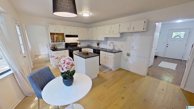 116 Pine Rock Ln, Hoover, AL 35226 - kitchen with black range with gas stovetop, a sink, white cabinetry, and a kitchen island