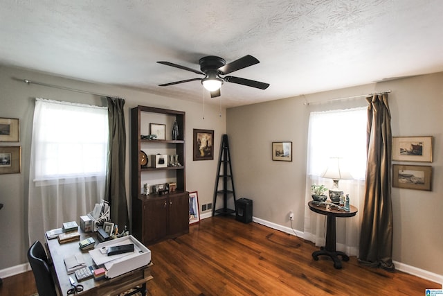 office featuring ceiling fan, dark wood-type flooring, and baseboards