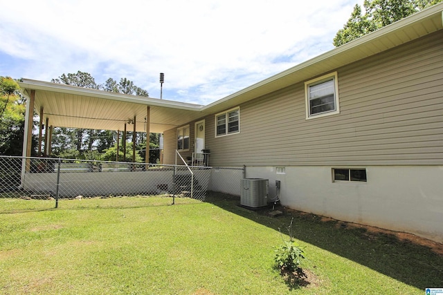 back of house featuring cooling unit