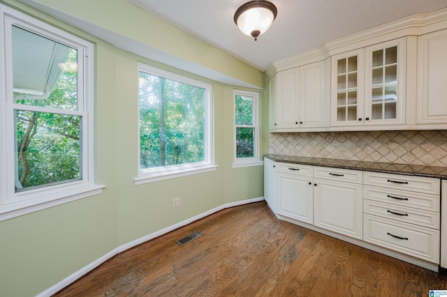 320 Cambo Ln, Hoover, AL 35244 - kitchen with glass insert cabinets, dark wood-type flooring, plenty of natural light, and decorative backsplash