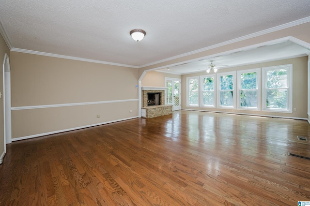 320 Cambo Ln, Hoover, AL 35244 - unfurnished living room featuring wood finished floors, a fireplace, a ceiling fan, a textured ceiling, and baseboards