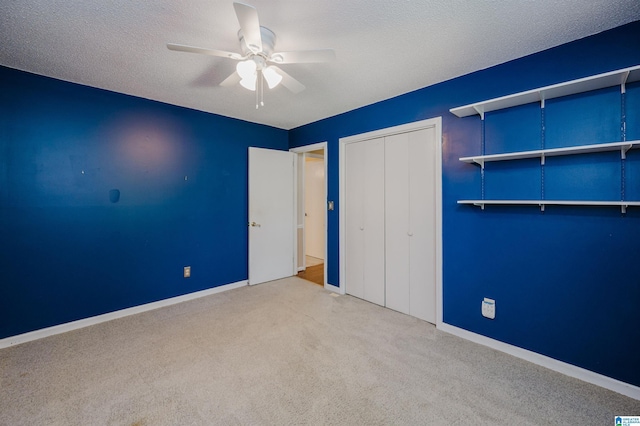 320 Cambo Ln, Hoover, AL 35244 - unfurnished bedroom featuring carpet flooring, a closet, baseboards, a ceiling fan, and a textured ceiling