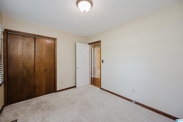 320 Cambo Ln, Hoover, AL 35244 - unfurnished bedroom with light colored carpet, a closet, and baseboards