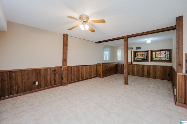 320 Cambo Ln, Hoover, AL 35244 - unfurnished room featuring a wainscoted wall, wood walls, and ceiling fan