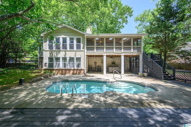 320 Cambo Ln, Hoover, AL 35244 - rear view of property with a patio area, a sunroom, an outdoor pool, stairs, and a wooden deck