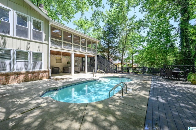 320 Cambo Ln, Hoover, AL 35244 - view of swimming pool featuring stairway, cooling unit, a wooden deck, a sunroom, and a patio area