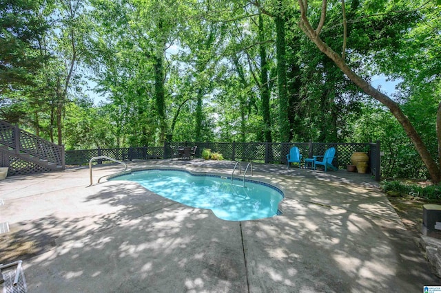 320 Cambo Ln, Hoover, AL 35244 - view of swimming pool featuring a patio area, fence, view of wooded area, and stairway