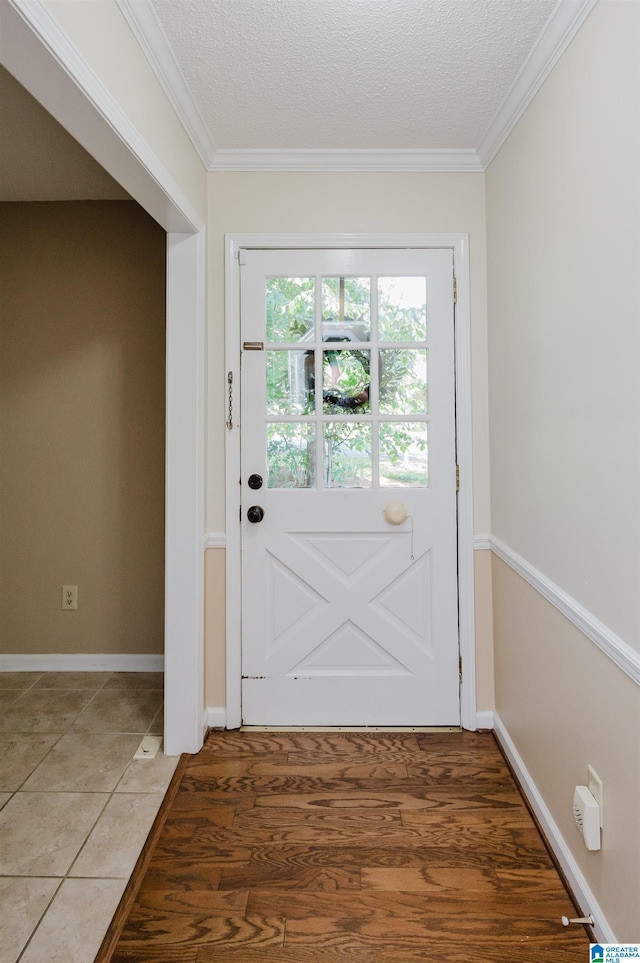 320 Cambo Ln, Hoover, AL 35244 - doorway with crown molding, a textured ceiling, light tile patterned floors, and baseboards