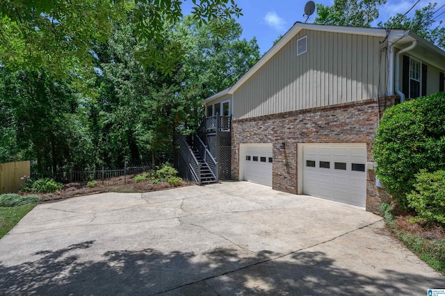 320 Cambo Ln, Hoover, AL 35244 - view of side of property featuring brick siding, concrete driveway, and fence