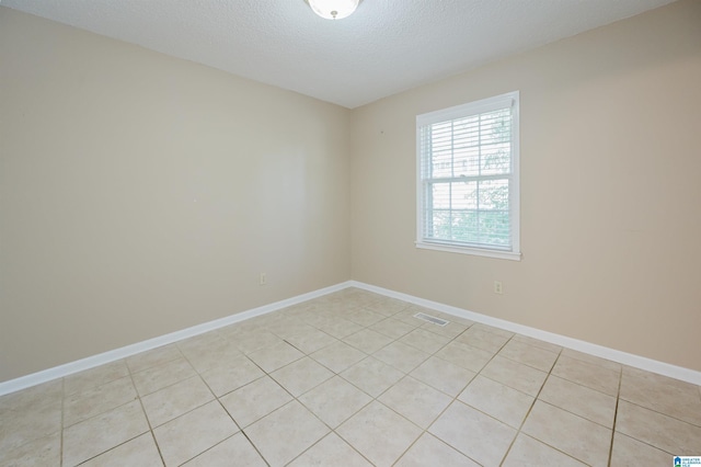 320 Cambo Ln, Hoover, AL 35244 - empty room with light tile patterned flooring, a textured ceiling, and baseboards