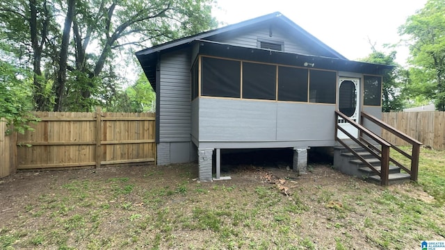 view of outbuilding with fence